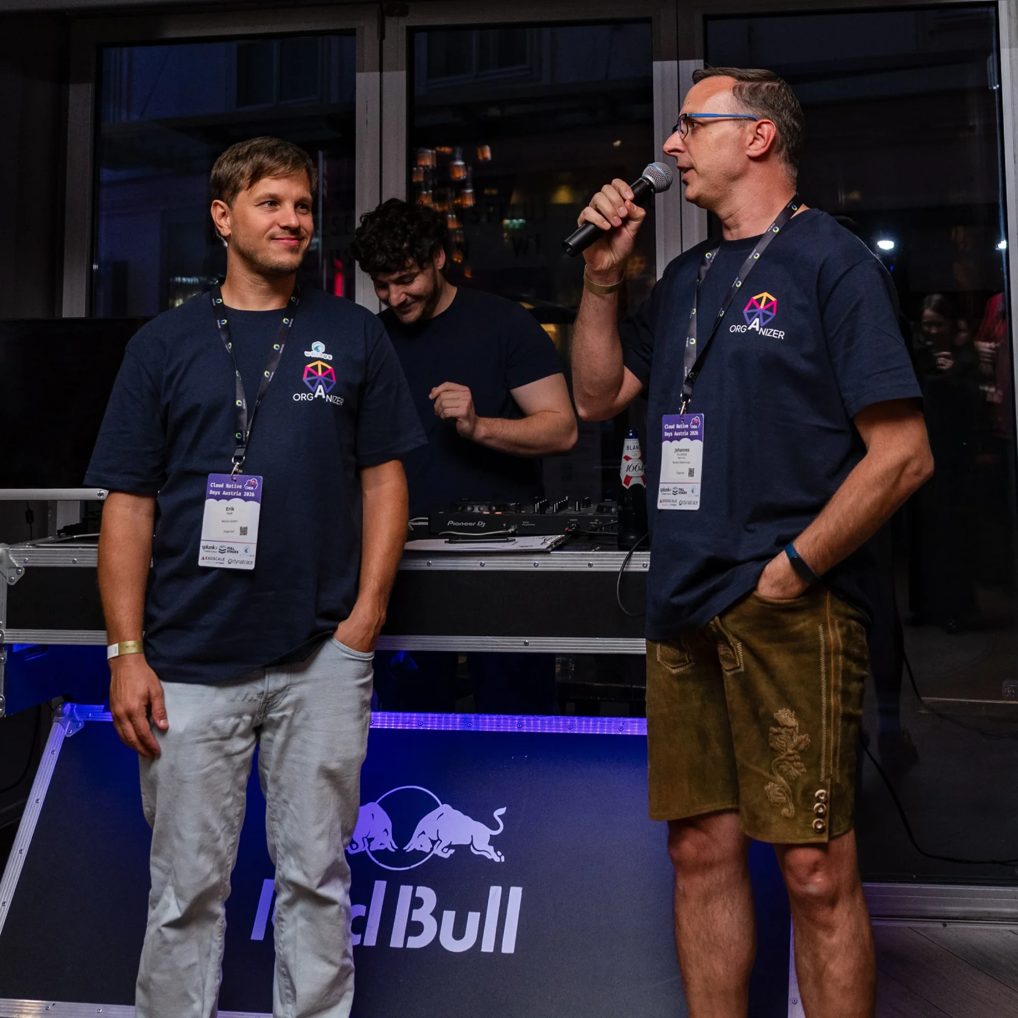 Two organizers on stage at the evening event