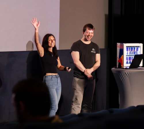 Two speakers giving a talk